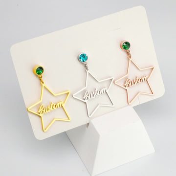 Personalised stainless steel star earrings with engraved name and birthstone crystal – elegant celestial jewellery gift for her.