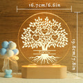 Close-up of custom family names engraved on acrylic tree design