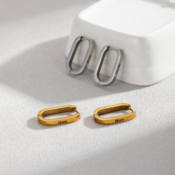 Personalised stainless steel U-shaped hoop earrings in silver, gold, and rose gold with custom engraved names – elegant minimalist jewellery gift for her.