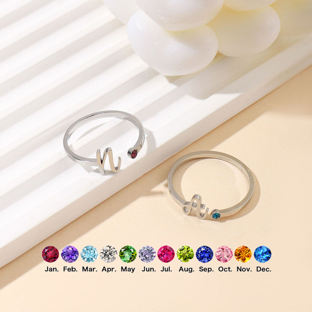 Personalised stainless steel initial open ring with birthstone crystal – adjustable minimalist jewellery gift for her.