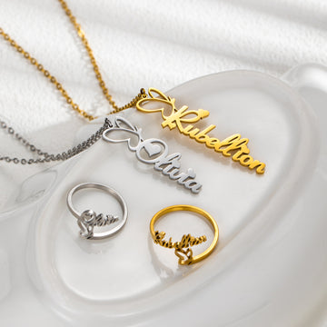 Personalised butterfly name necklace and matching ring in gold and silver – custom engraved gift for her.