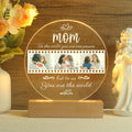 Personalised LED night light with engraved names on a wooden base – a thoughtful gift for mothers, families or baby celebrations.