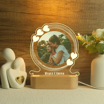 Personalised night light with wooden base featuring a custom photo of a couple and engraved names “Bruce & Karen,” a romantic custom gift idea for her by Your Gifting NZ.