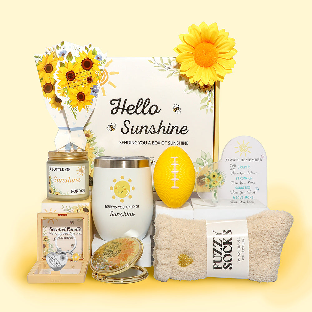 Sunshine themed gift box featuring sunflower bouquet, stainless-steel tumbler, scented candle, fuzzy socks, stress ball, inspirational acrylic plaque and makeup mirror.