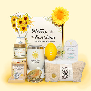 Sunshine themed gift box featuring sunflower bouquet, stainless-steel tumbler, scented candle, fuzzy socks, stress ball, inspirational acrylic plaque and makeup mirror.