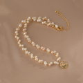 Handmade pearl necklace with 14K gold-plated medallion pendant