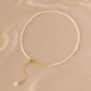 Handcrafted freshwater pearl necklace with natural pearls and gold-tone chain
