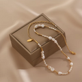 Handmade freshwater pearl necklace in S925 sterling silver on beige background