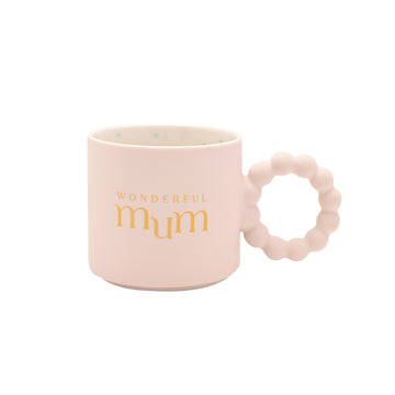 Pink ceramic “Wonderful Mum” mug with gold lettering, bubble-style handle, and pastel confetti interior — boxed mug gift for mothers.