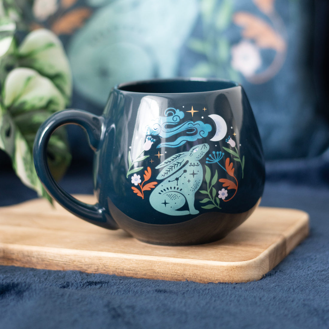 Midnight Hare Rounded Mug featuring moon and hare design on deep navy ceramic, celestial-themed cup with floral details, in coloured gift box.