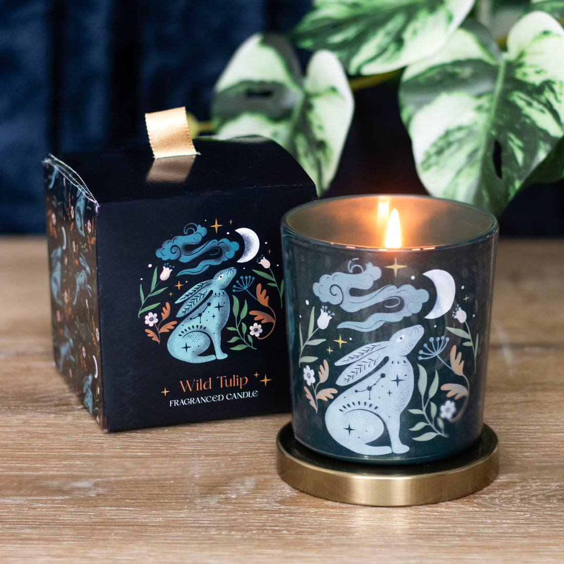Midnight Hare Wild Tulip Candle in black glass jar with gold lid and illustrated gift box – moon and hare design.