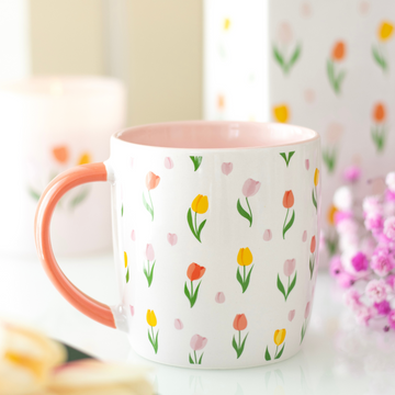 White ceramic mug with pink tulip print and pink interior — perfect floral gift for Mother’s Day or birthdays.