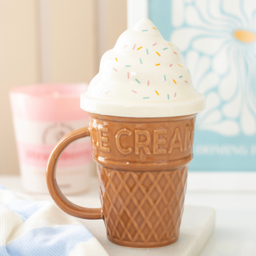 Ice Cream Lidded Mug shaped like a waffle cone with white swirl lid and colourful sprinkles, pastel ceramic cup in gift box packaging.