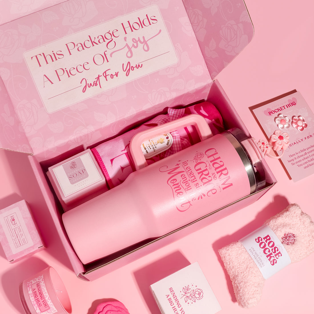 Pink Elegant Rose pamper gift box with tumbler, towel, fuzzy socks, candle, rose soap, bath bomb and pocket hug card.