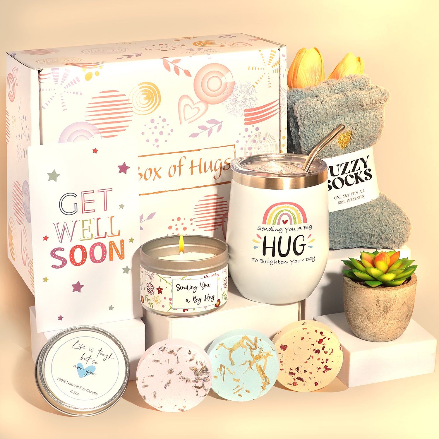 A Box of Hugs get well soon gift box with tumbler, fuzzy socks, greeting card, candle, succulent and shower steamers.