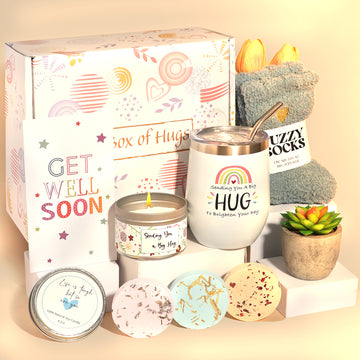 A Box of Hugs get well soon gift box with tumbler, fuzzy socks, greeting card, candle, succulent and shower steamers.