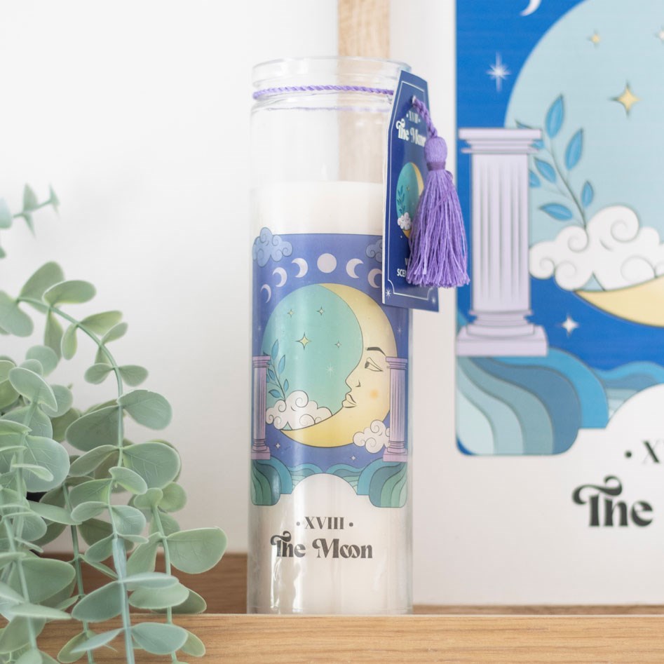 The Moon Violet scented tube candle with tarot-inspired moon design, tall glass jar, and lavender tassel.
