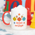 Merry and Bright Christmas ceramic mug with red handle and festive bauble design, boxed and ready to gift.