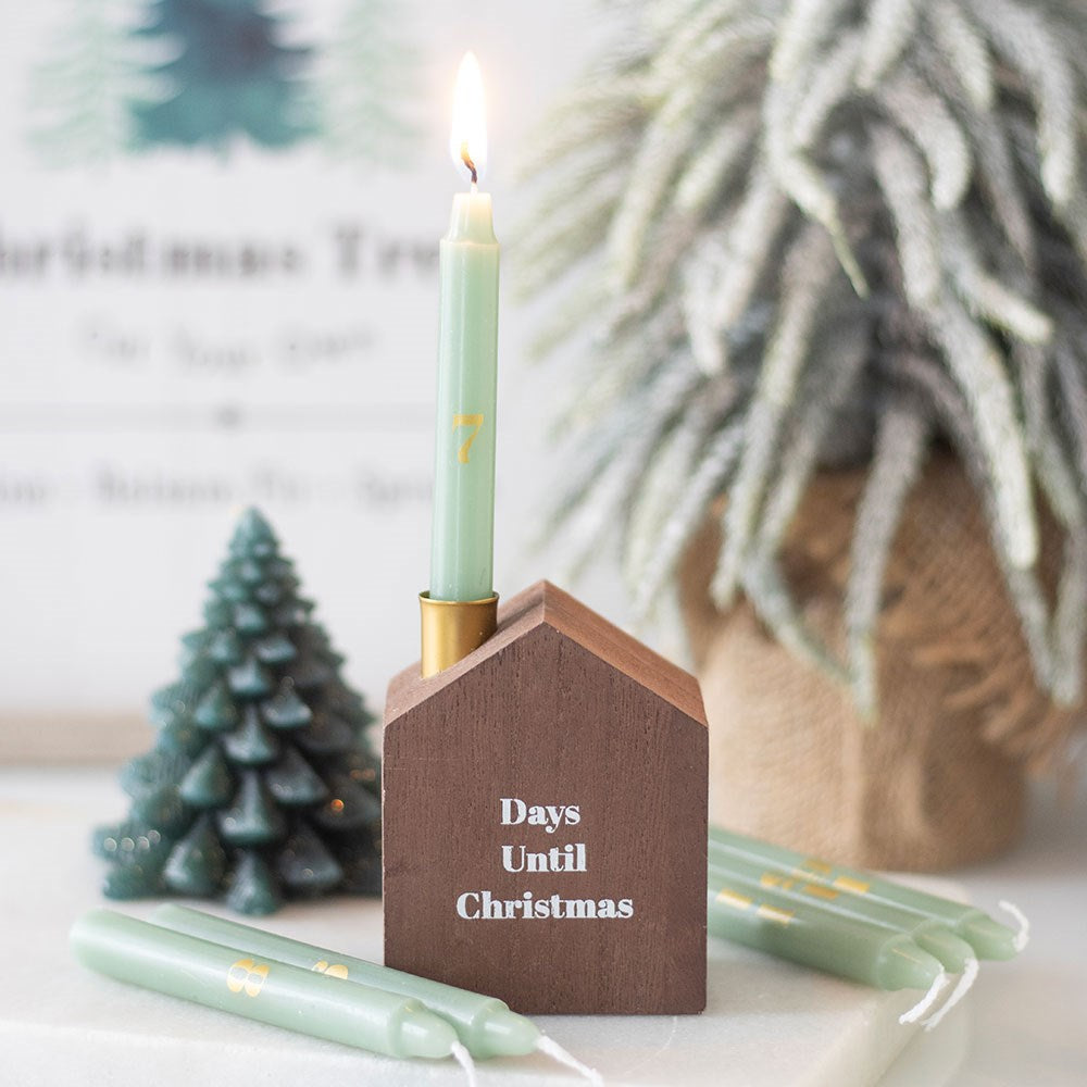 Mini advent candle set with wooden holder reading “Days Until Christmas” – 24 numbered candles for festive countdown.