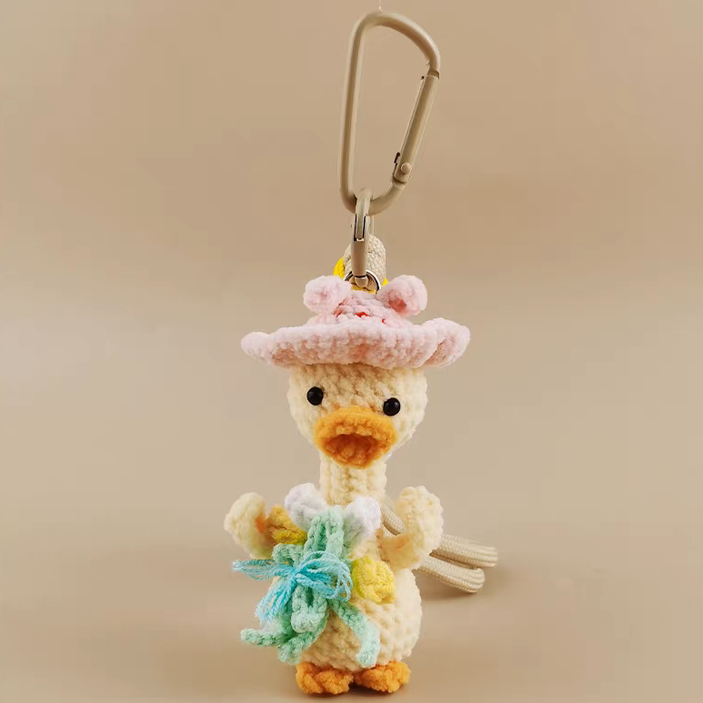 handmade crochet duck keychain with straw hat
