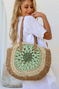 Woman carrying a mint and tan circle weave tote bag – handcrafted women’s tote and perfect gift for her