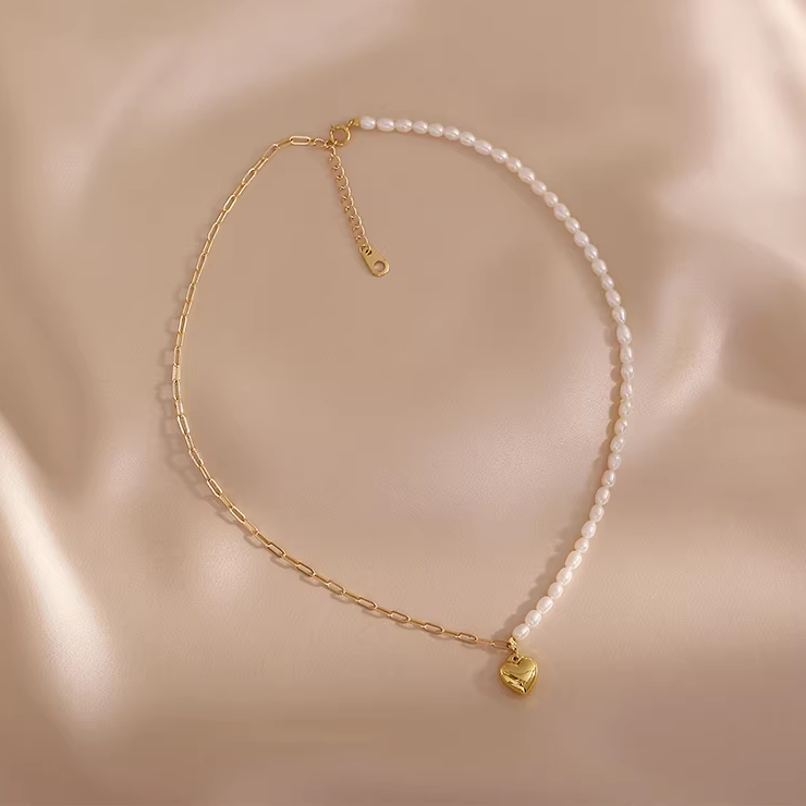 Elegant handmade pearl necklace featuring heart pendant and freshwater pearls