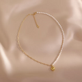 Elegant handmade pearl necklace featuring heart pendant and freshwater pearls