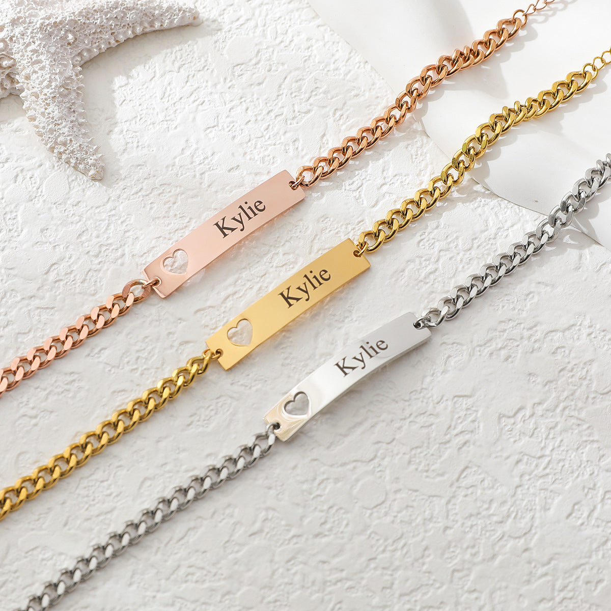 Personalised name bracelet with heart cut-out in gold, silver, and rose gold – custom engraved gift for her or him.