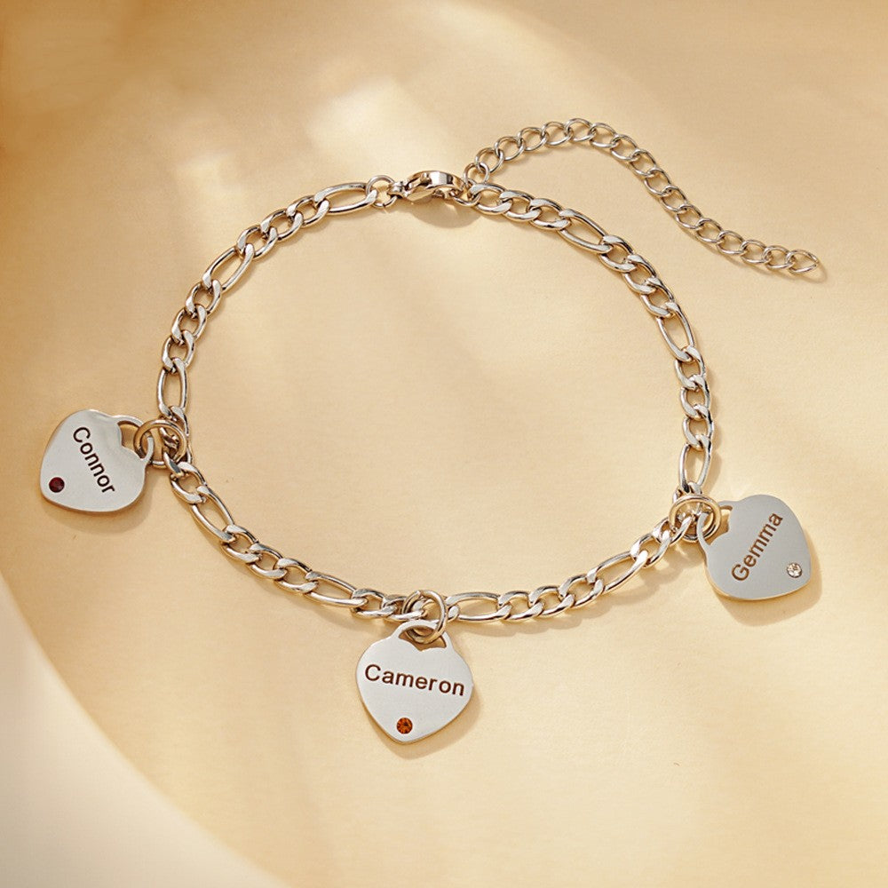 Custom heart tag bracelet in gold and silver with engraving and birthstone option