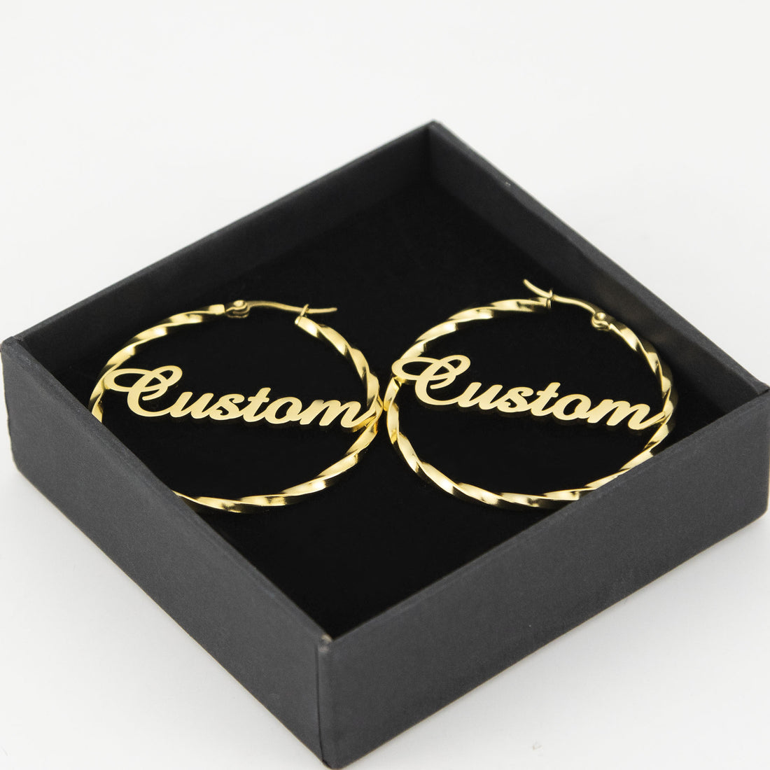 Personalised gold twisted hoop earrings with custom name in script font — stylish stainless steel circle earrings gift for her.