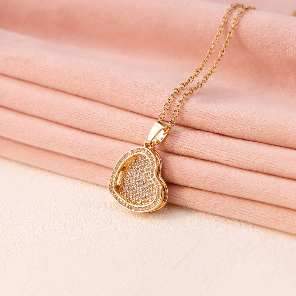 Gold heart locket necklace with engraved name inside