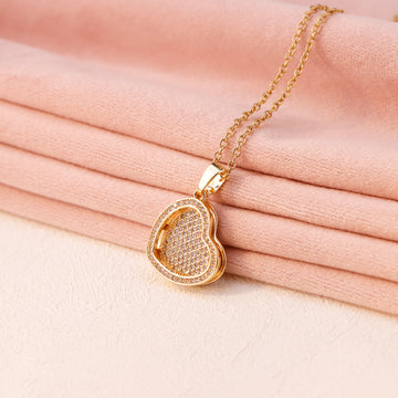 Gold heart locket necklace with engraved name inside