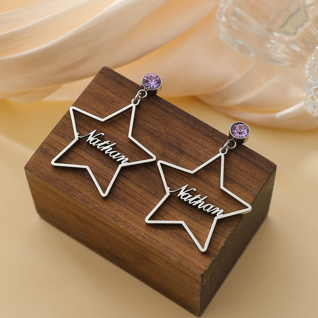 Personalised stainless steel star earrings with engraved name and birthstone crystal – elegant celestial jewellery gift for her.