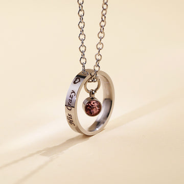 Stainless steel circle necklace with personalised engraving and blue birthstone