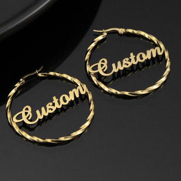Personalised gold twisted hoop earrings with custom name in script font — stylish stainless steel circle earrings gift for her.