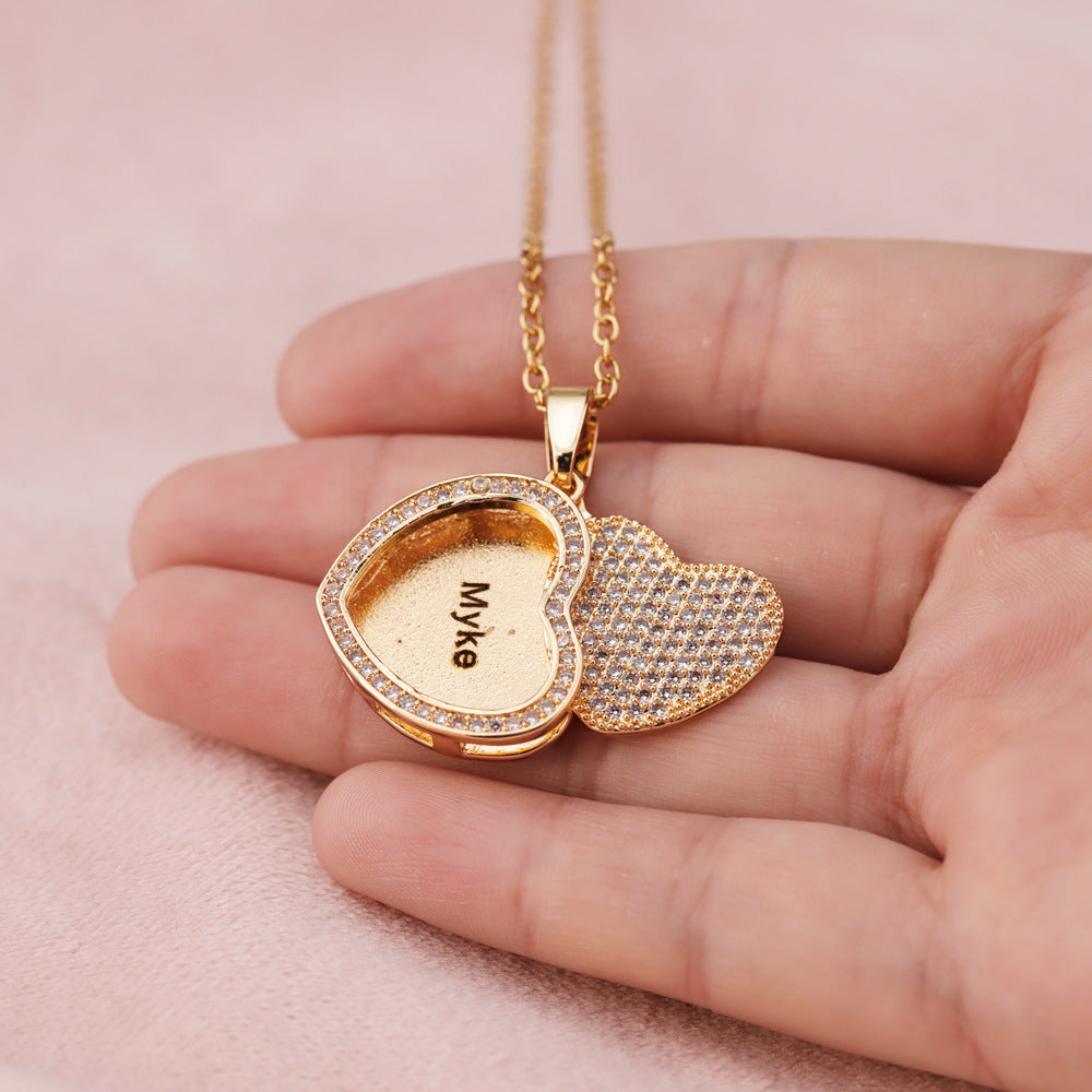 Gold heart locket necklace with engraved name inside