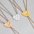 Close-up of engraved names and birthstones on interlocking heart pendant