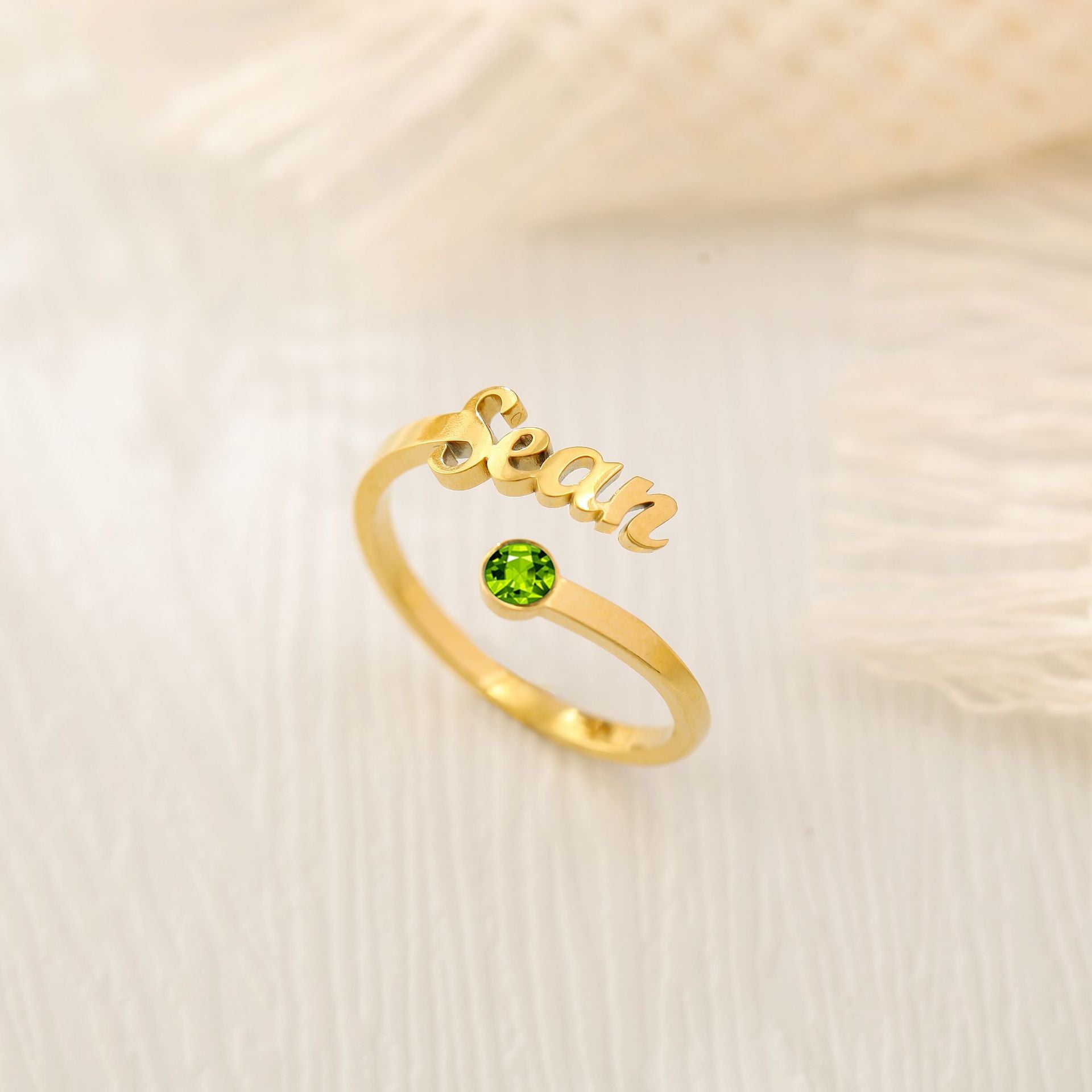 Personalised gold name ring with green birthstone – custom engraved adjustable gift for her.