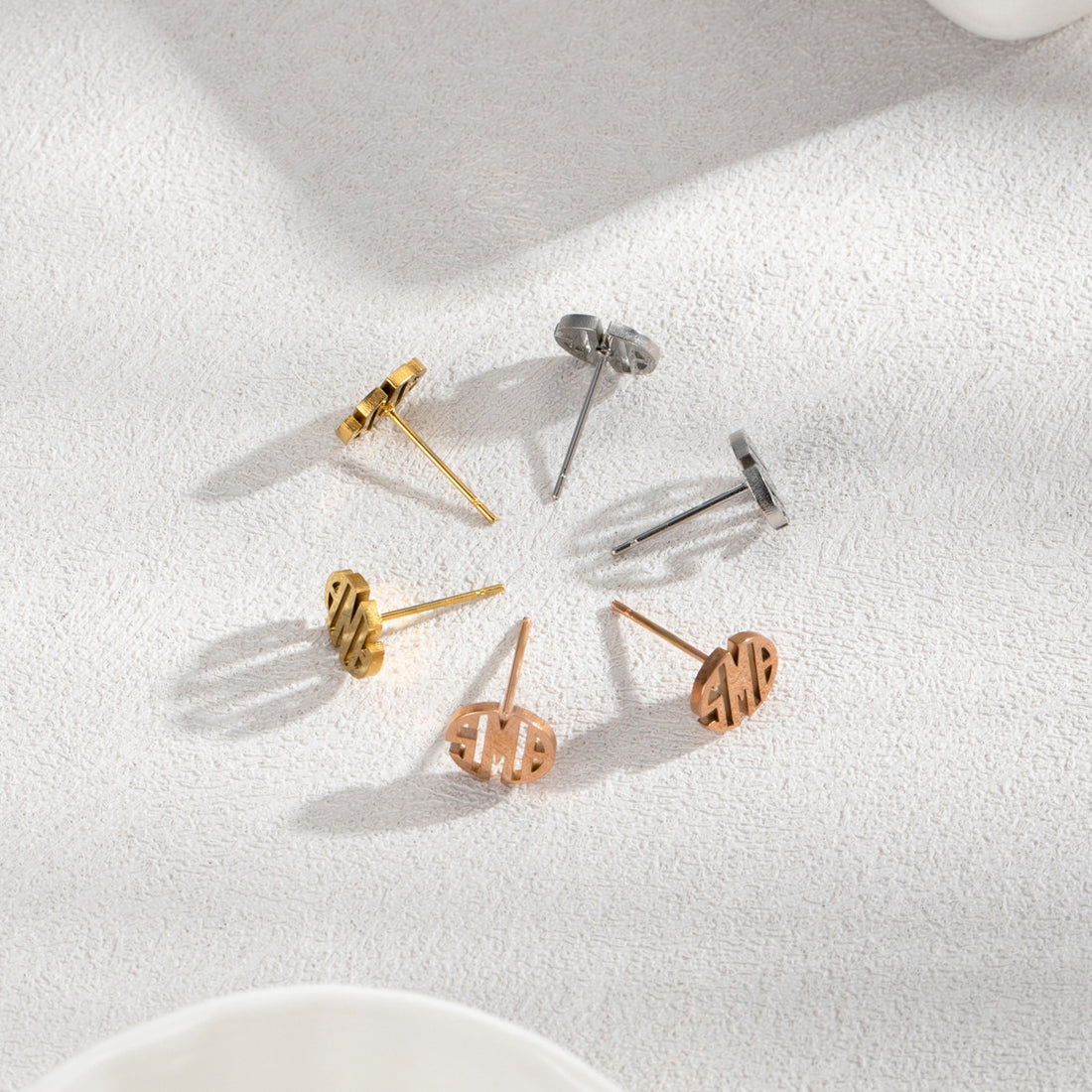 Personalised round monogram stud earrings in silver, gold, and rose gold with custom engraved initials — elegant minimalist stainless steel gift for her.