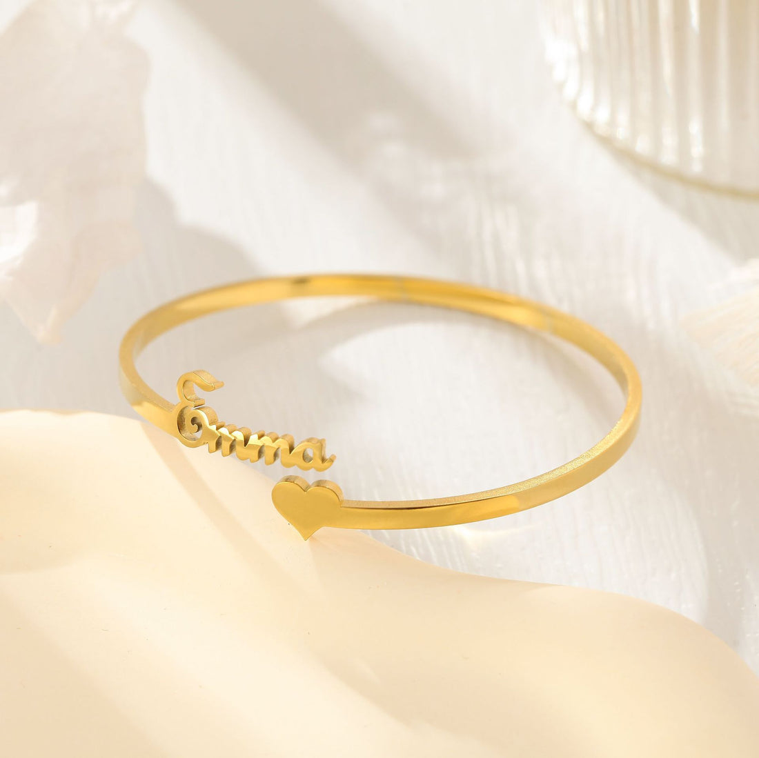 Gold personalised heart name bangle with open cuff design – custom engraved bracelet gift for her.
