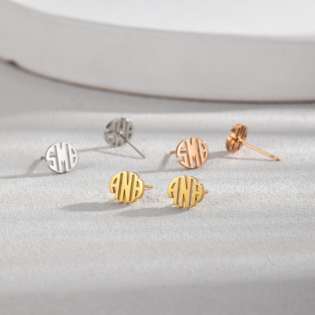 Personalised round monogram stud earrings in silver, gold, and rose gold with custom engraved initials — elegant minimalist stainless steel gift for her.