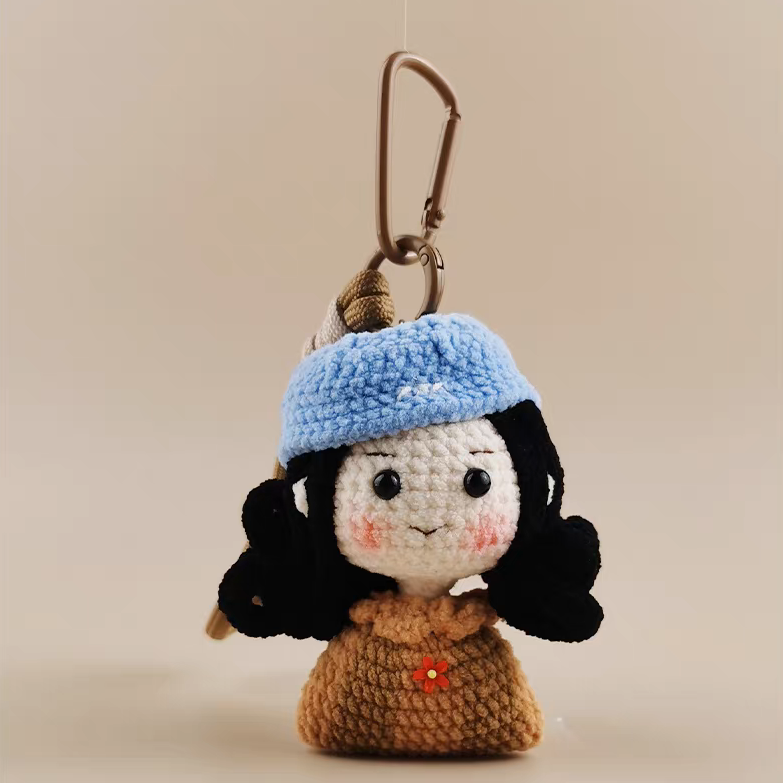 handmade crochet sailor girl keychain with blue hat
